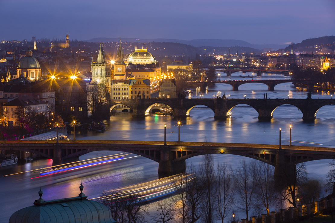the Manes, Charles and Legion Bridges over the Vltava River at dusk, with the Old Town on the left, Prague, Czech Republic